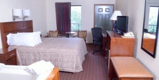 King bedroom with jacuzzi tub at Valley forge Inn in Pigeon Forge Tn
