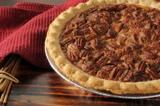 A delicious pecan pie on a table.