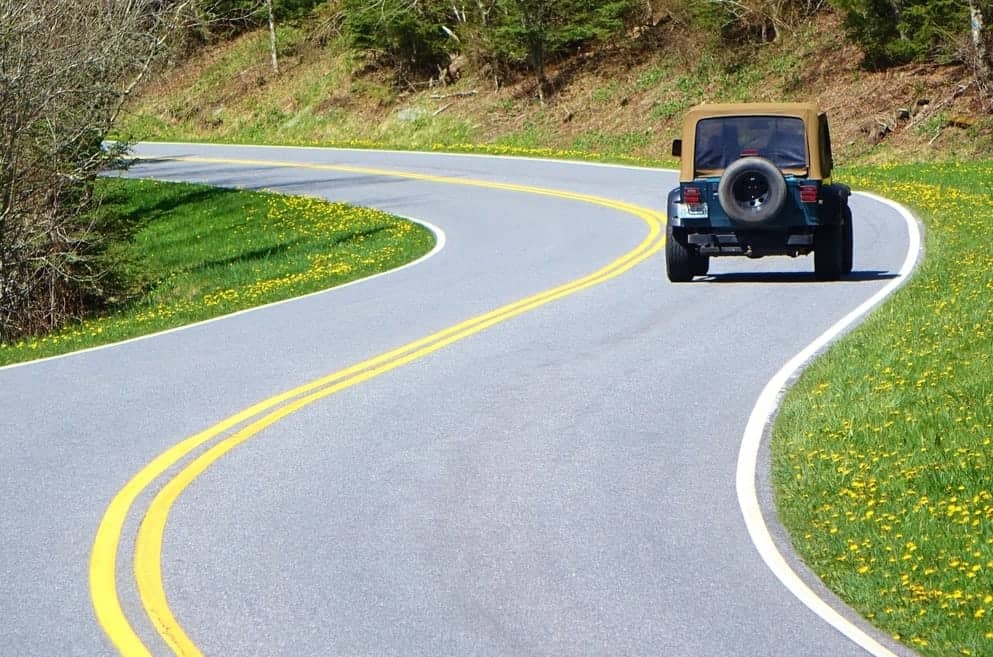 Jeep driving on a road in the Smoky Mountains
