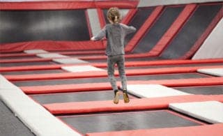 kid jumping on trampoline