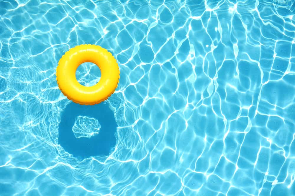 yellow inner tube in a swimming pool