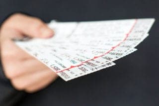 person holding tickets