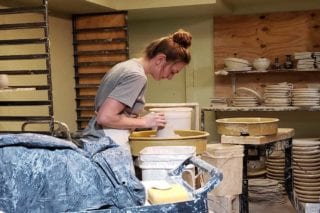girl making pottery at pigeon river pottery in pigeon forge